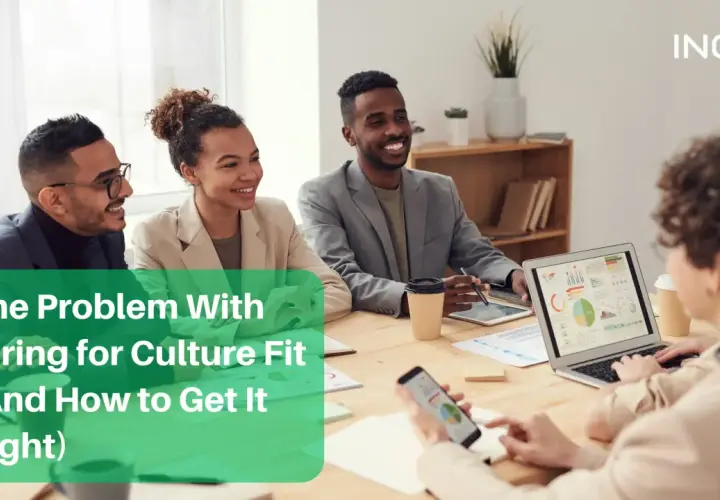 Diverse team in a meeting discussing hiring for culture fit.