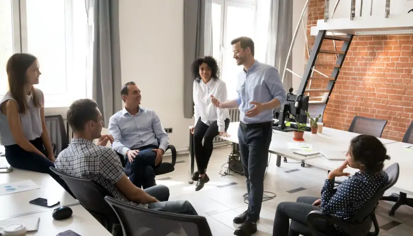 A team discusses strategy, perhaps outlining the chief strategy officer job description.
