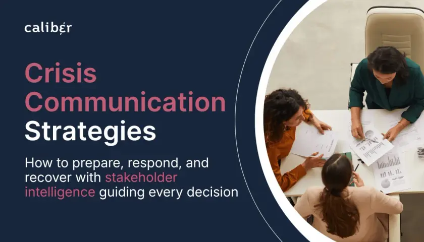 Three women strategize around a table, discussing documents. The image highlights "Crisis Communication Strategies," emphasizing stakeholder intelligence for effective decision-making.