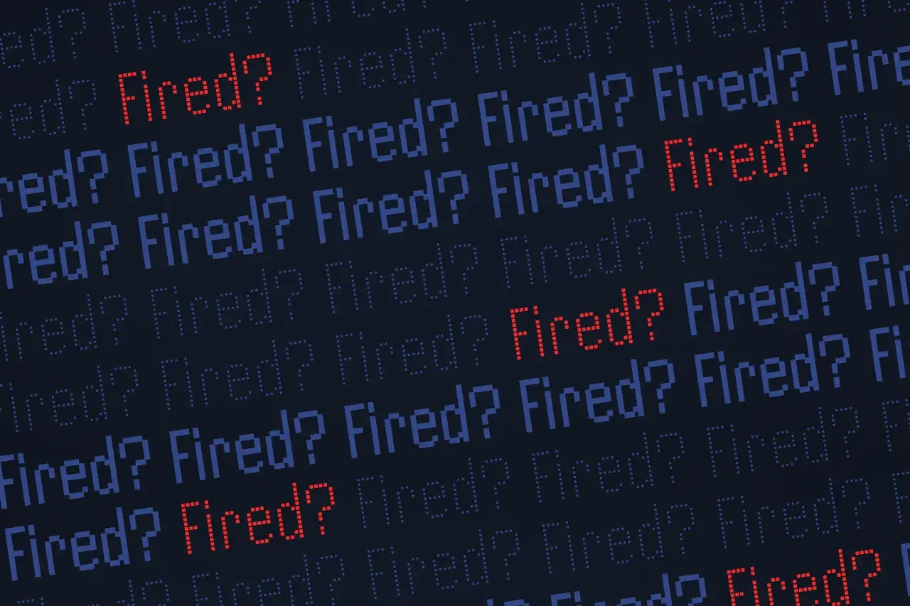 Rows of pixelated text ask "Fired?". Some are blue, but a few stand out in red, fueling the thought: am I getting fired or just paranoid?