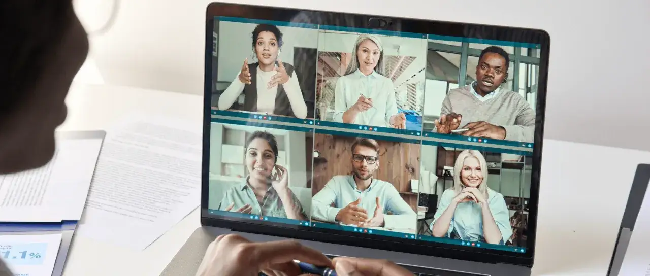 A diverse group of people on a video call, demonstrating how to host a virtual networking event.