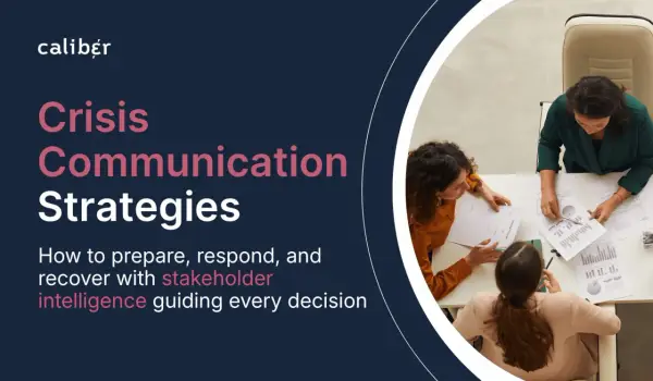 Three women strategize around a table, discussing documents. The image highlights "Crisis Communication Strategies," emphasizing stakeholder intelligence for effective decision-making.
